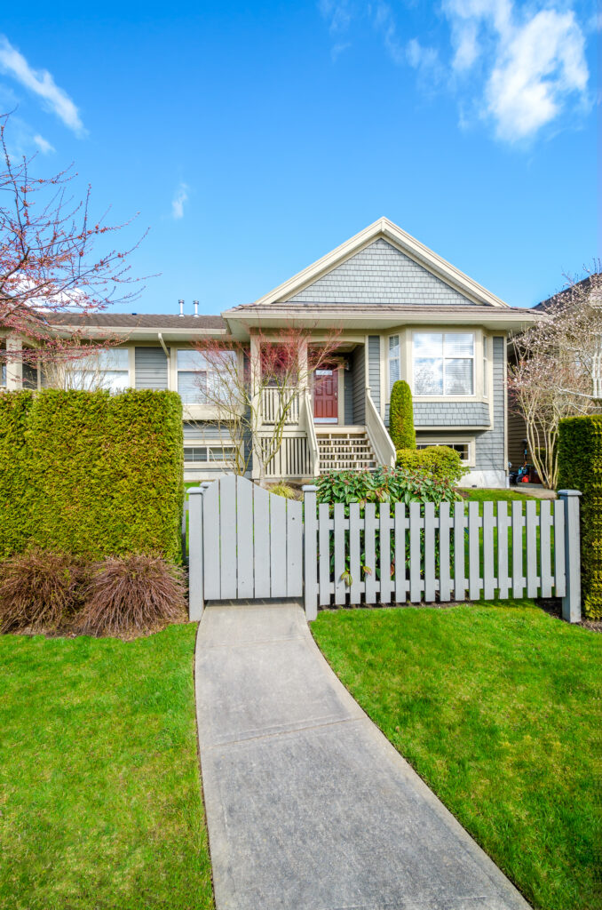 beautiful-house-with-blue-rustic-fence-on-a-sunny